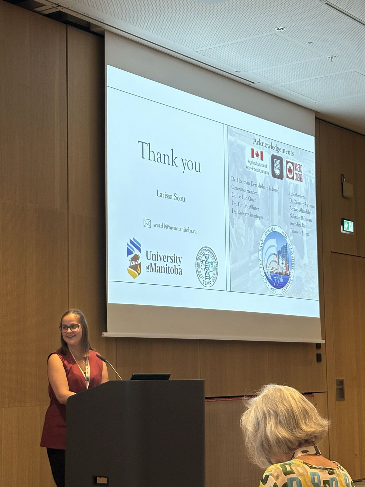 Larissa Scott at the podium on her acknowledgements slide