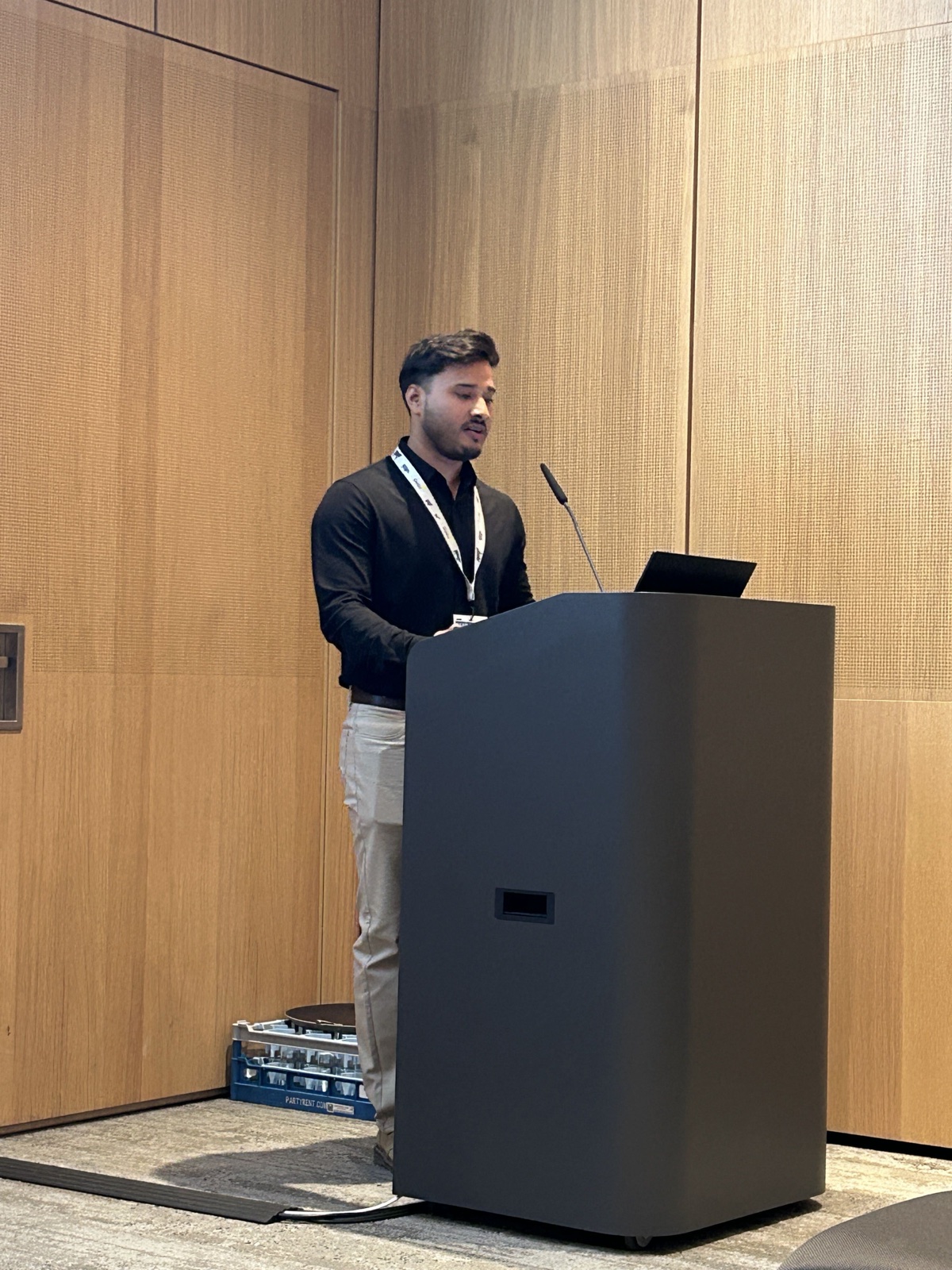 Nahidur Rahman presenting at the podium at EAAP 2026